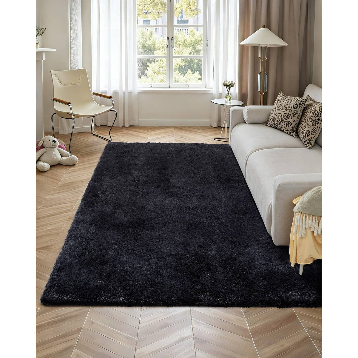 Black shag plush area rug on hardwood floor in a living room setting
