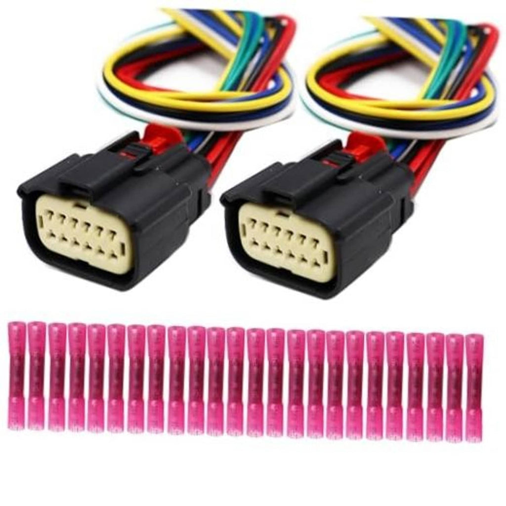 Pair of black 12-pin headlight connectors with multi-color wire bundles and pink tips