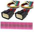 Pair of black 12-pin headlight connectors with multi-color wire bundles and pink tips