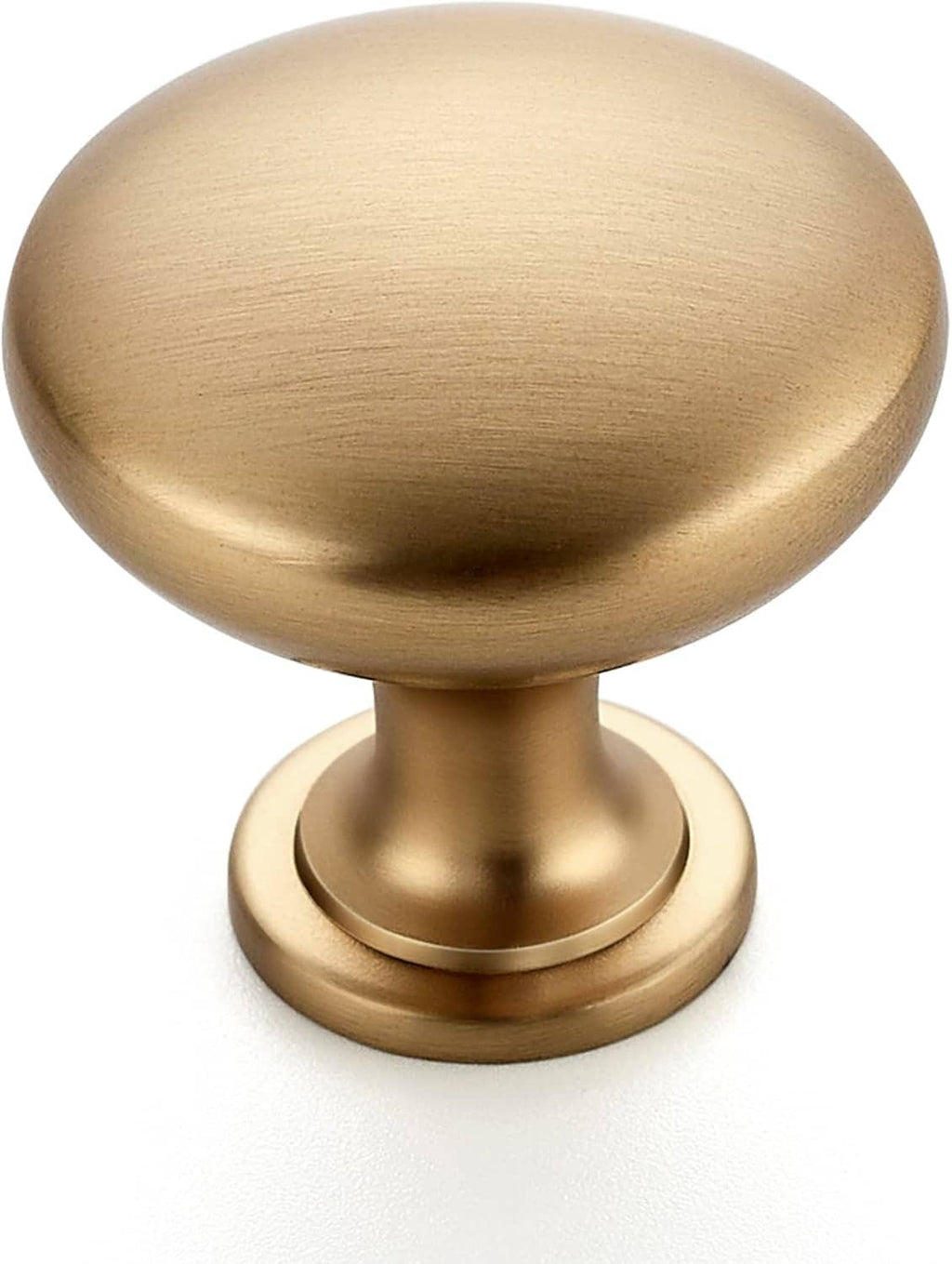 Close-up of champagne bronze round cabinet knob with brushed metallic finish
