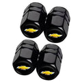 Set of four black tire valve stem caps with gold Chevrolet bowtie logo