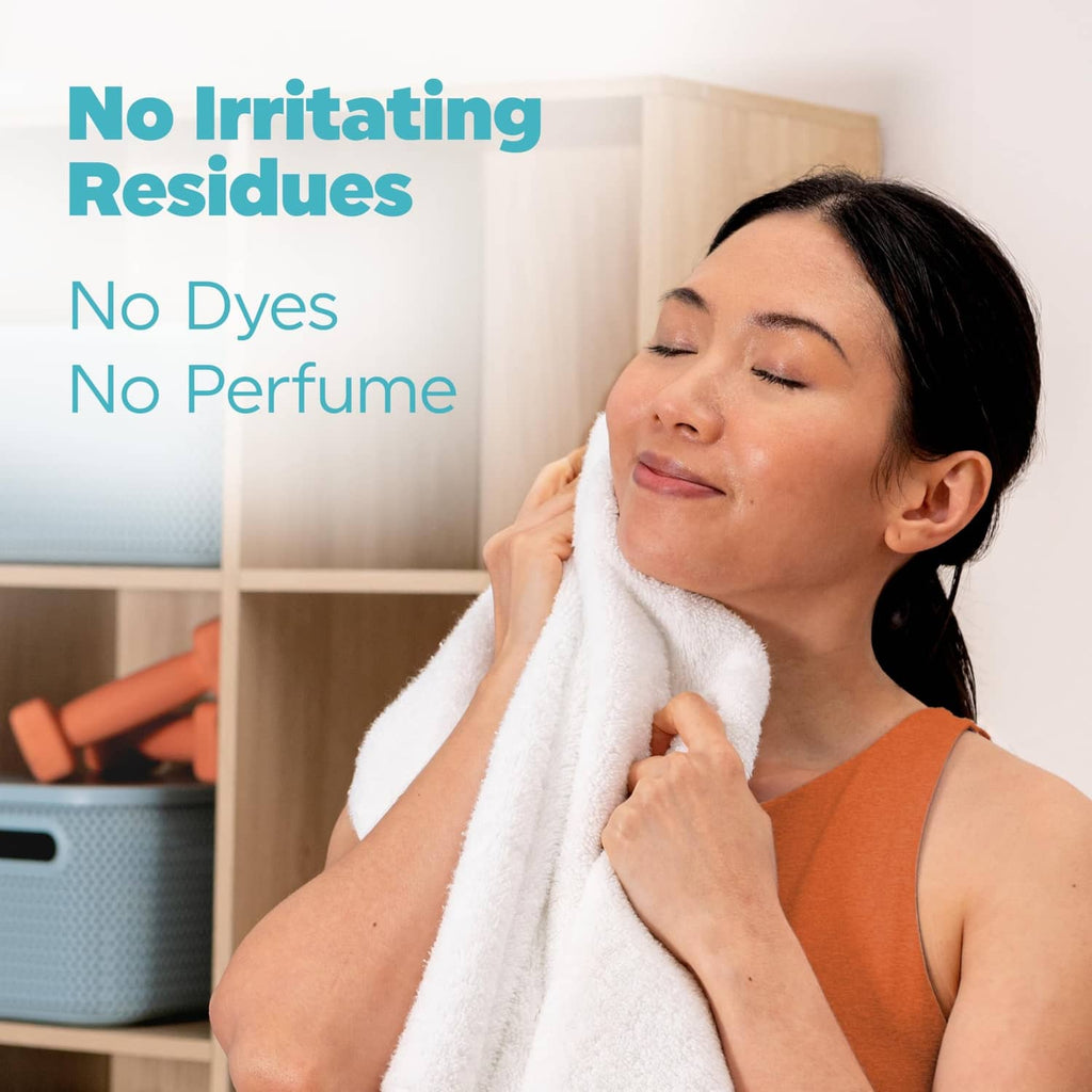 Woman wiping with a white towel, Tide Free & Gentle fragrance-free detergent