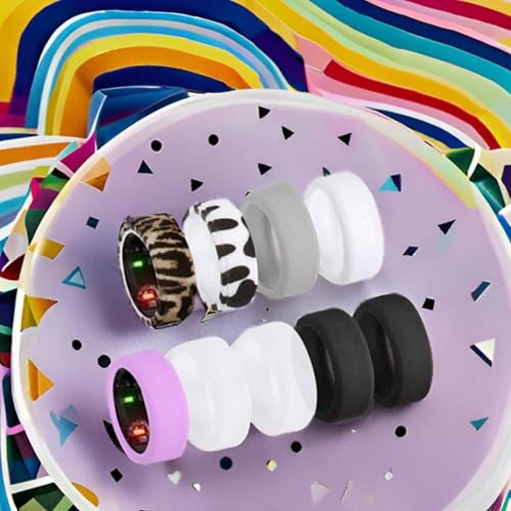Close-up of 5 ring covers: leopard, zebra, purple, white, and black