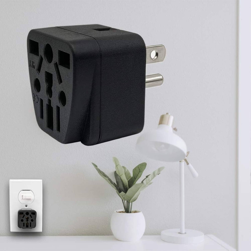 Black travel plug adapter mounted in wall outlet with compact two-prong plug