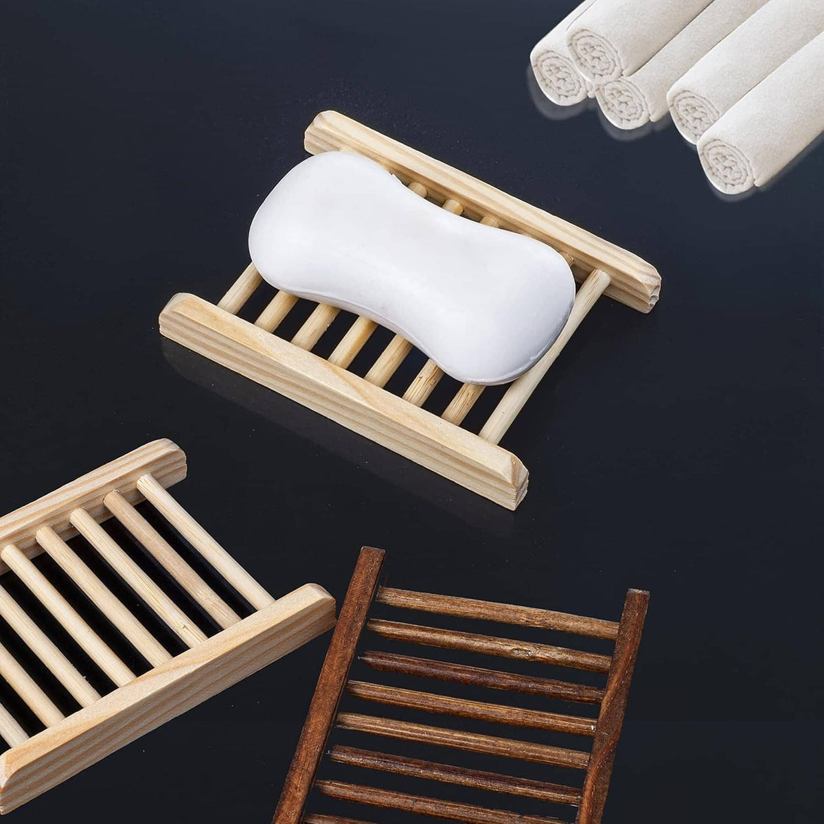 Light bamboo soap holder with white soap bar resting on slatted tray