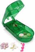 Green pill splitter open tray showing tablets in separate positions