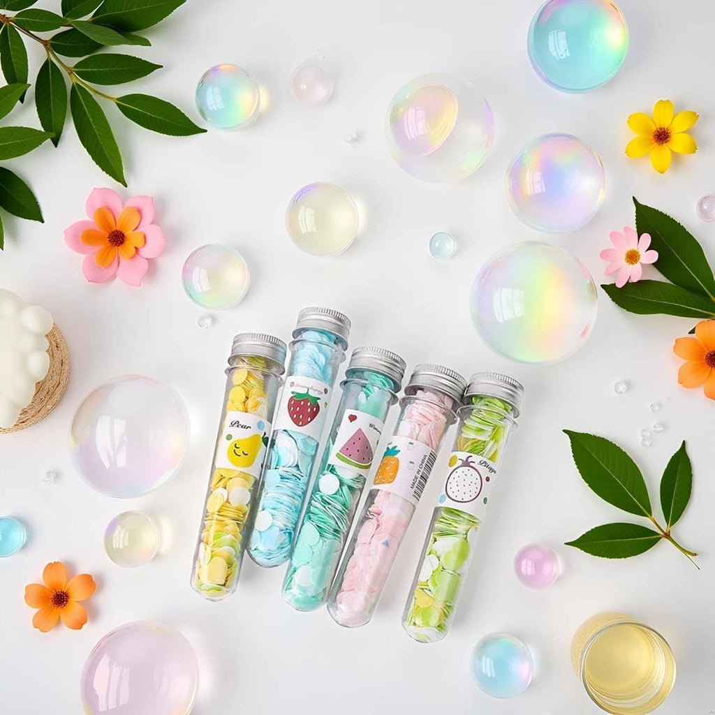 Portable soap confetti tubes, multiple clear bottles with colorful fruit-themed pieces