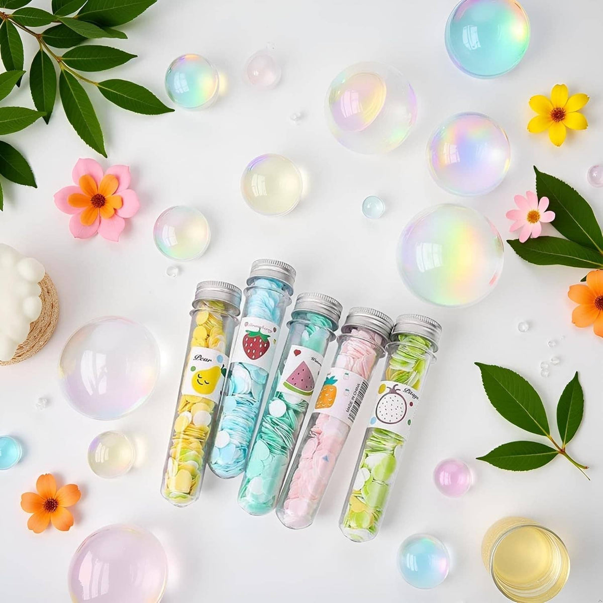 Portable soap confetti tubes, multiple clear bottles with colorful fruit-themed pieces