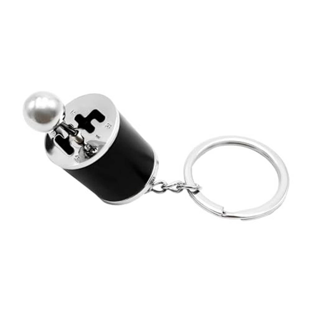 Car gear shifter keychain featuring a black cylinder body, silver top, and keyring