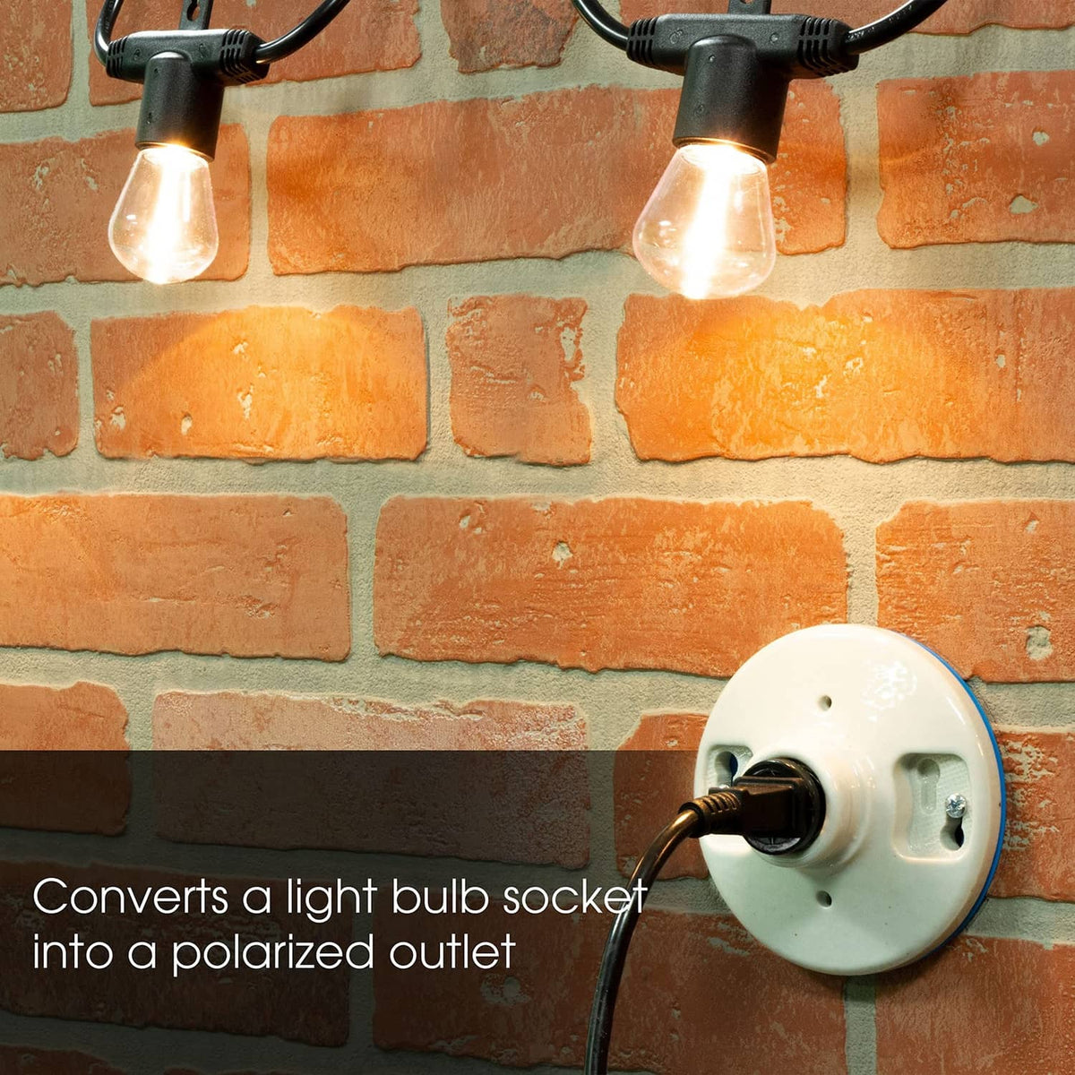 White polarized outlet adapter with two cords and light bulb sockets connected