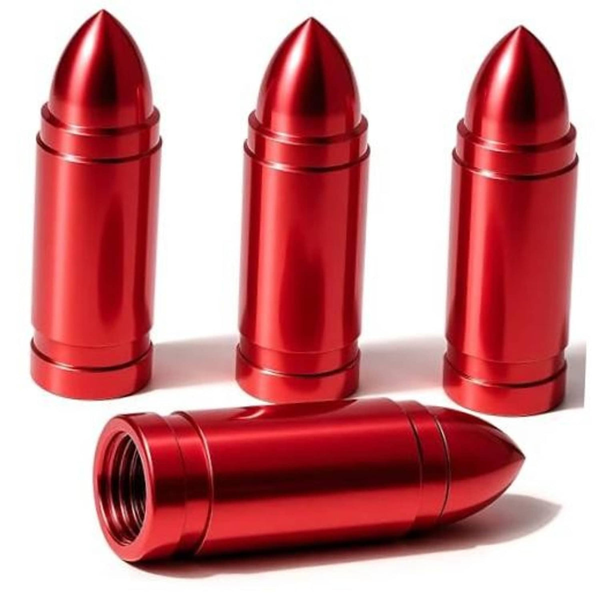 Set of red bullet tire valve stem caps with metallic ridges and threaded opening