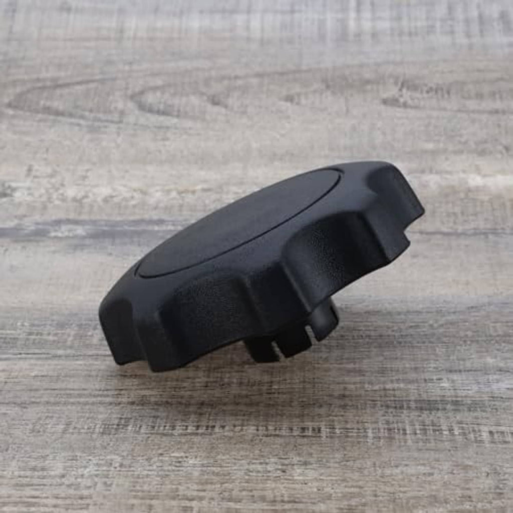 Black plastic car seat adjustment knob, low-profile side tab
