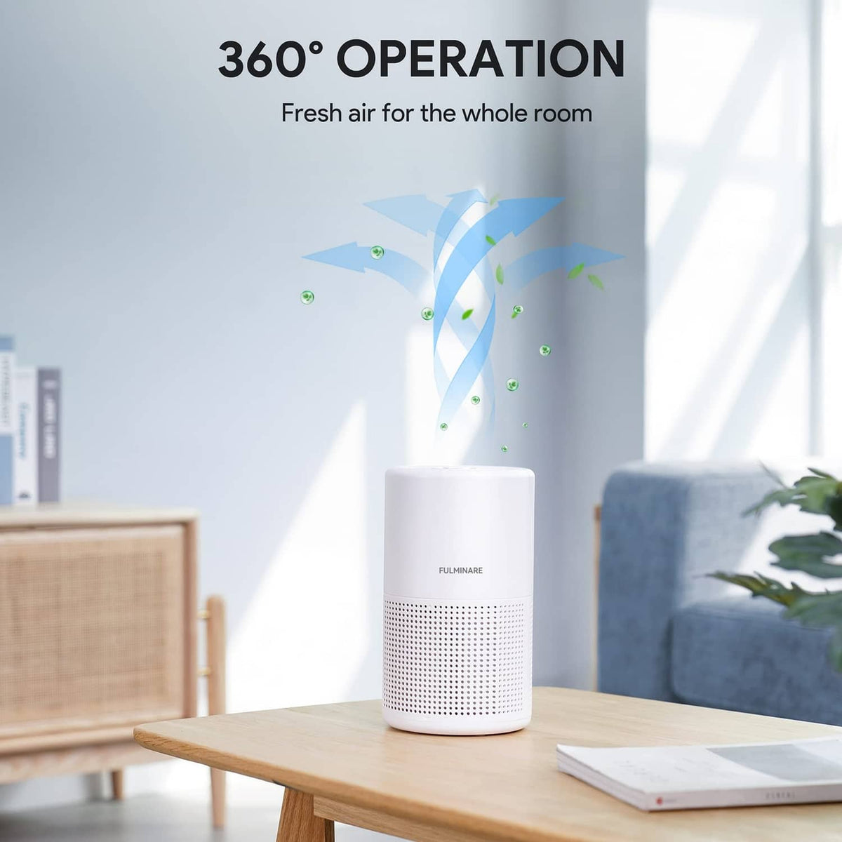 White air purifier centered on a table with front grille and 360° airflow outlet design