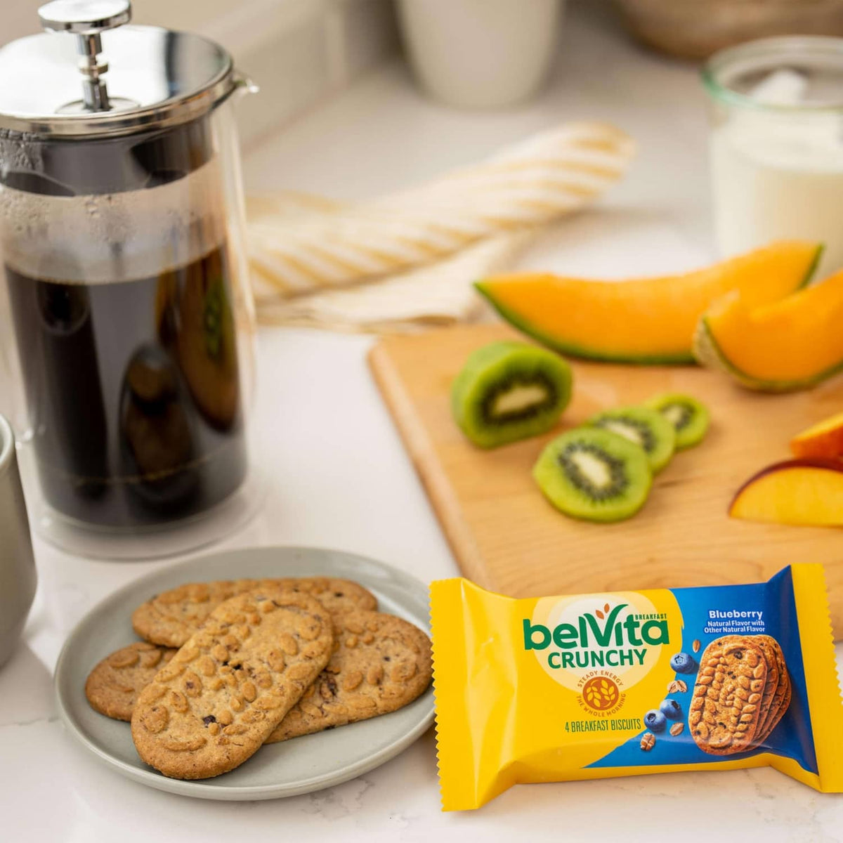 belVita Crunchy Blueberry breakfast biscuits on a plate with a snack pack