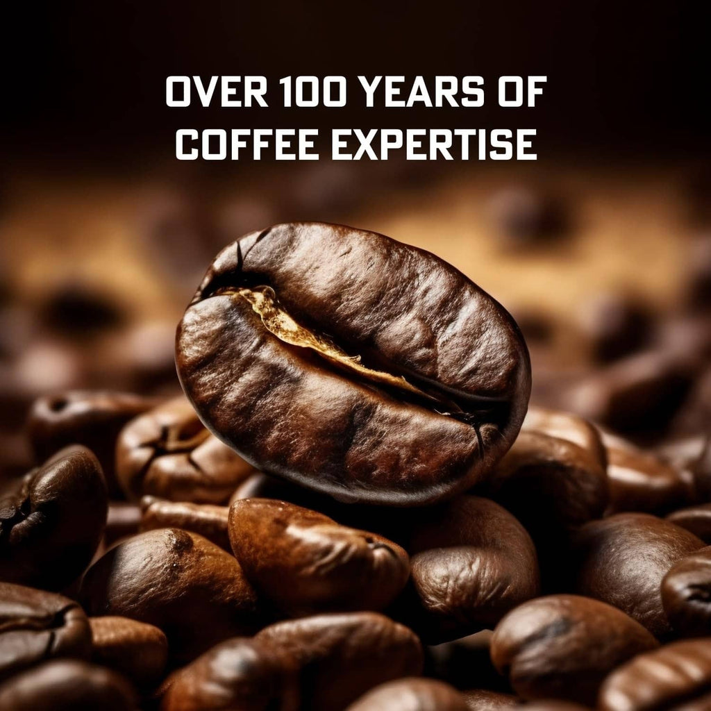 Single dark roasted coffee bean on top of a pile of beans
