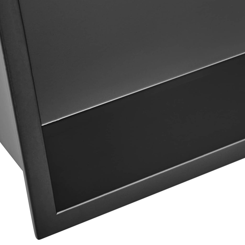 Close-up of black stainless steel shower niche shelf edge and smooth interior finish