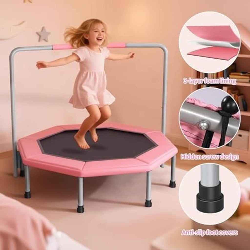 Pink mini trampoline with black octagon bounce mat, safety frame, and toddler jumping
