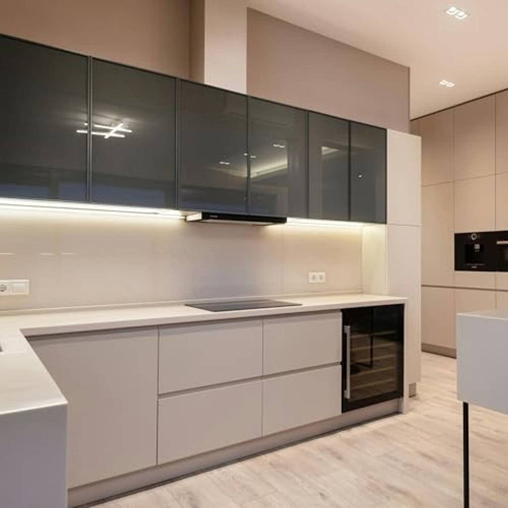 Under-cabinet LED lighting glow in a modern kitchen with light cabinetry