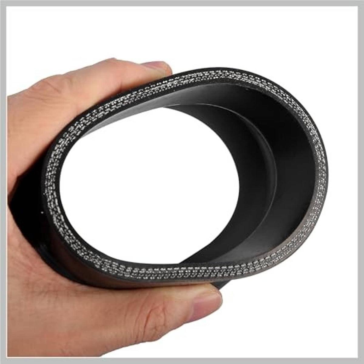 Black silicone hose reducer coupler held in hand, reinforced flared rim and opening
