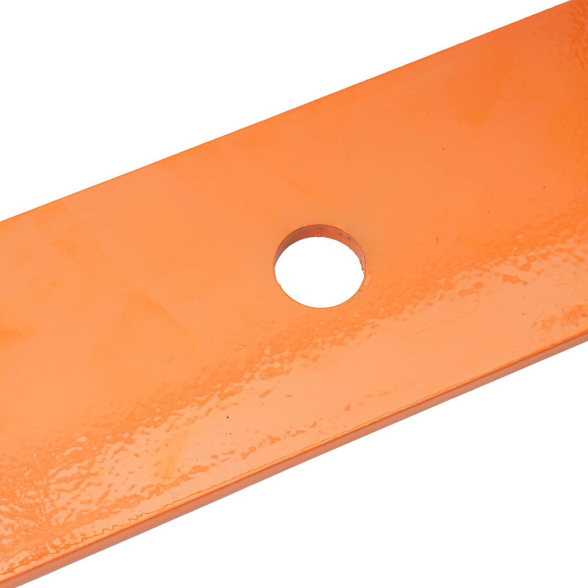 Close-up of orange mower blade with round center mounting hole