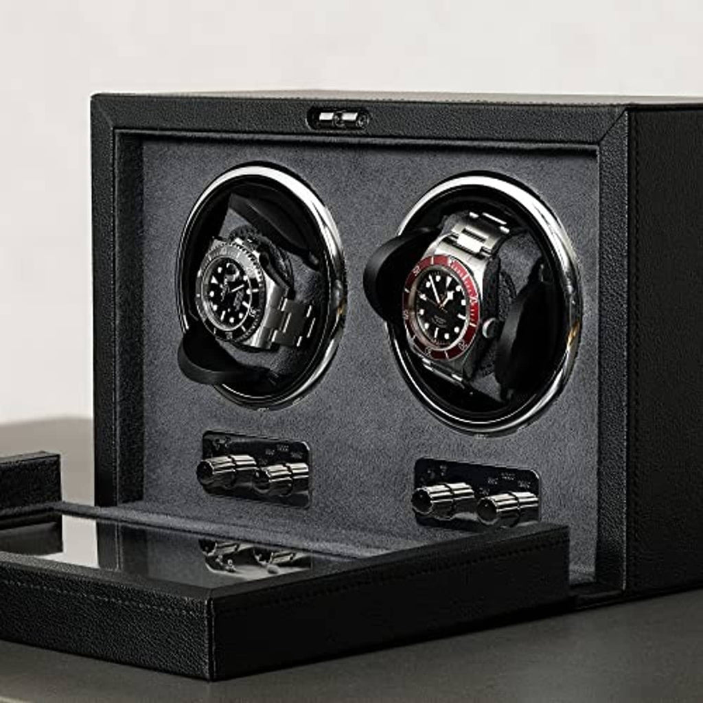 Close-up of black double watch winder interior with two watch cradles and controls