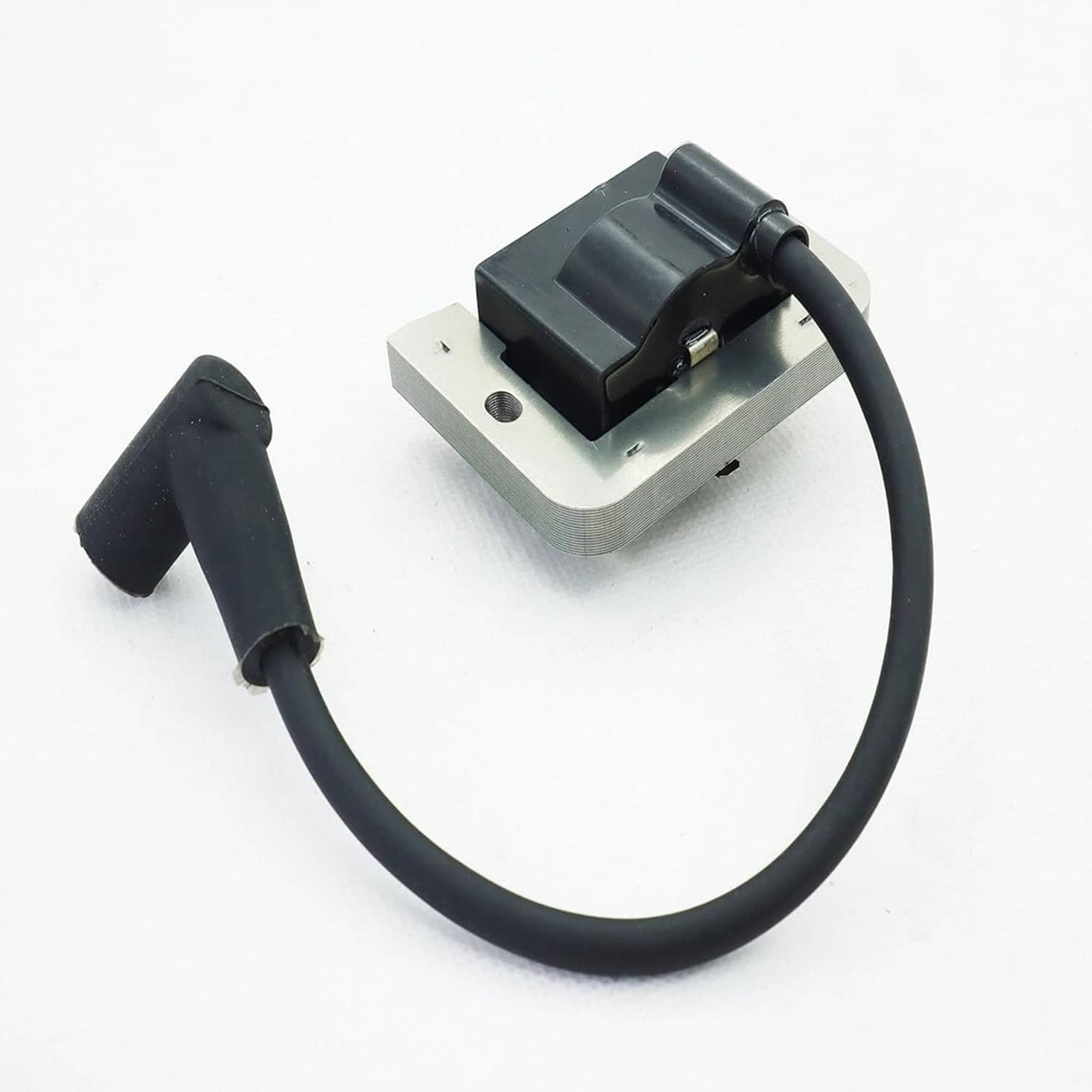 Ignition module with black coil housing, wire boot and gray mounting bracket, angled