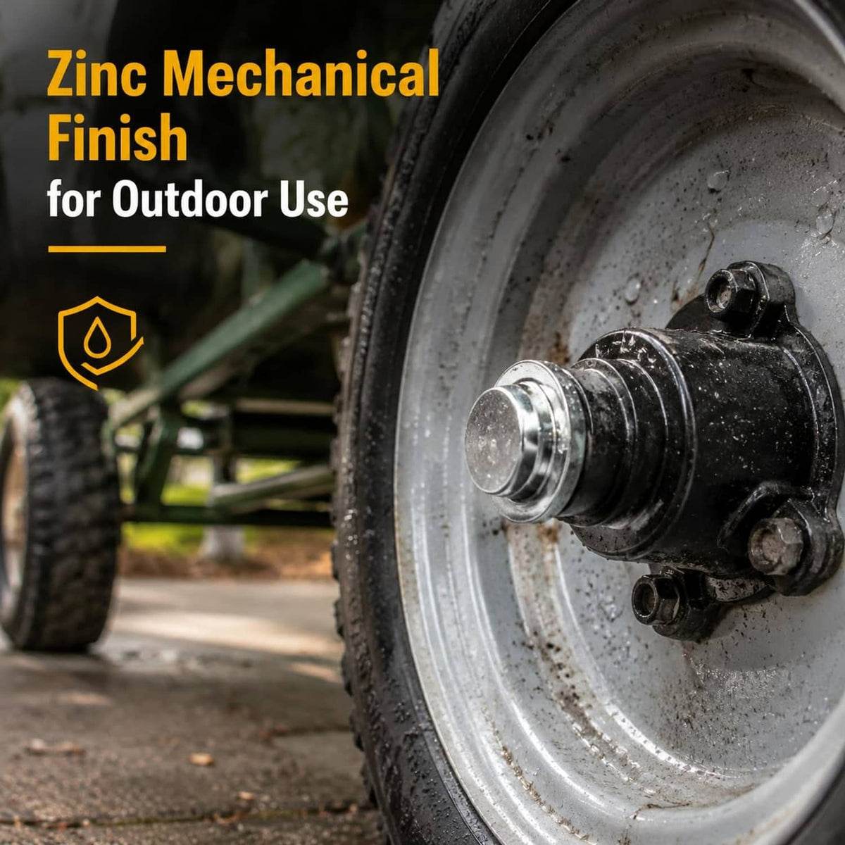 Silver zinc-finished pushnut axle cap on an axle hub end