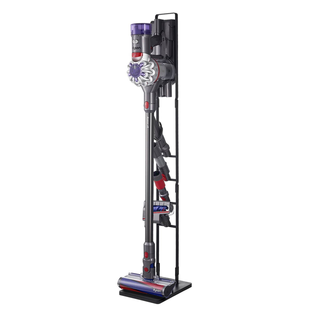Upright cordless vacuum on black stand with side hooks and flat base