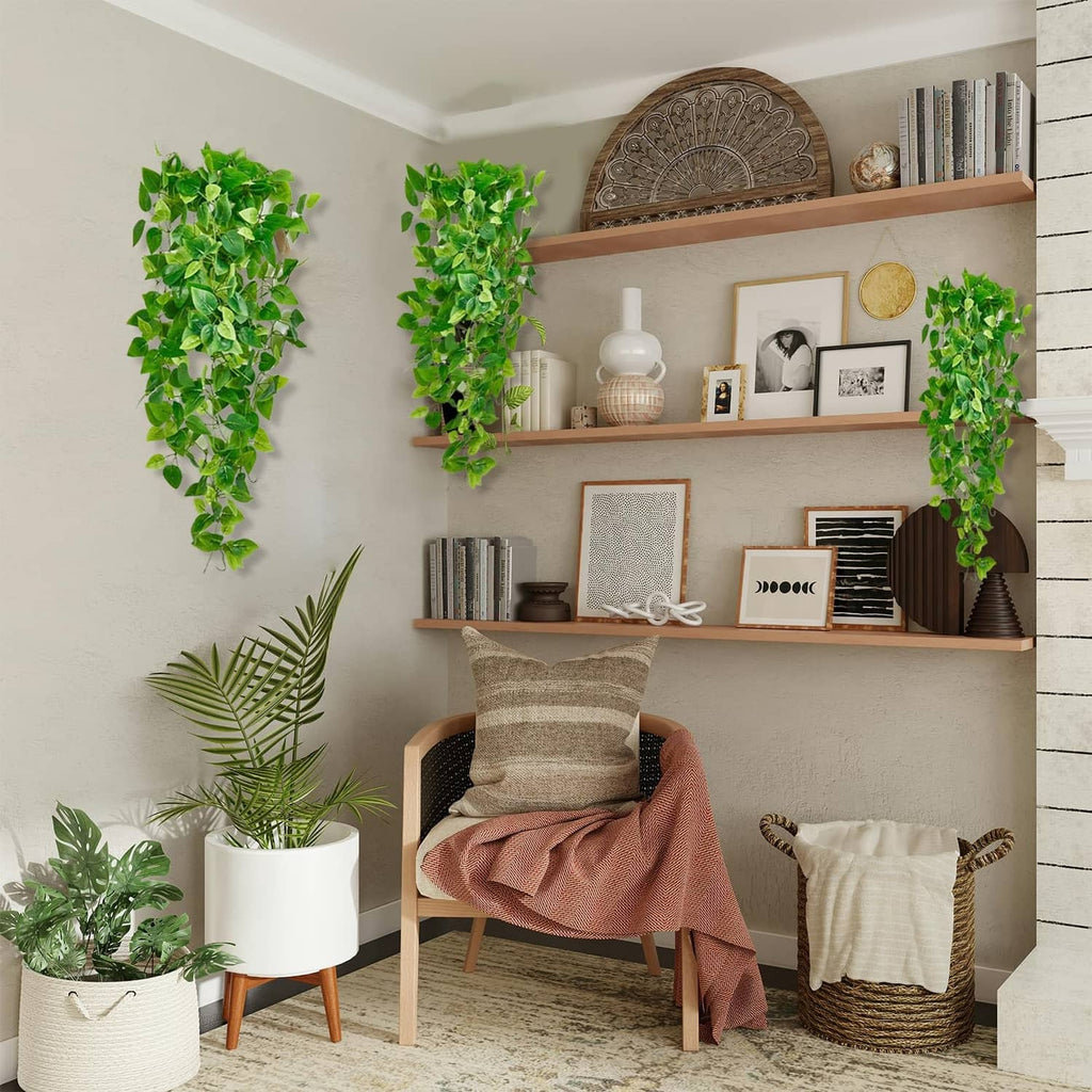 Multiple artificial hanging vine plants with green leaves for indoor wall and shelf decor