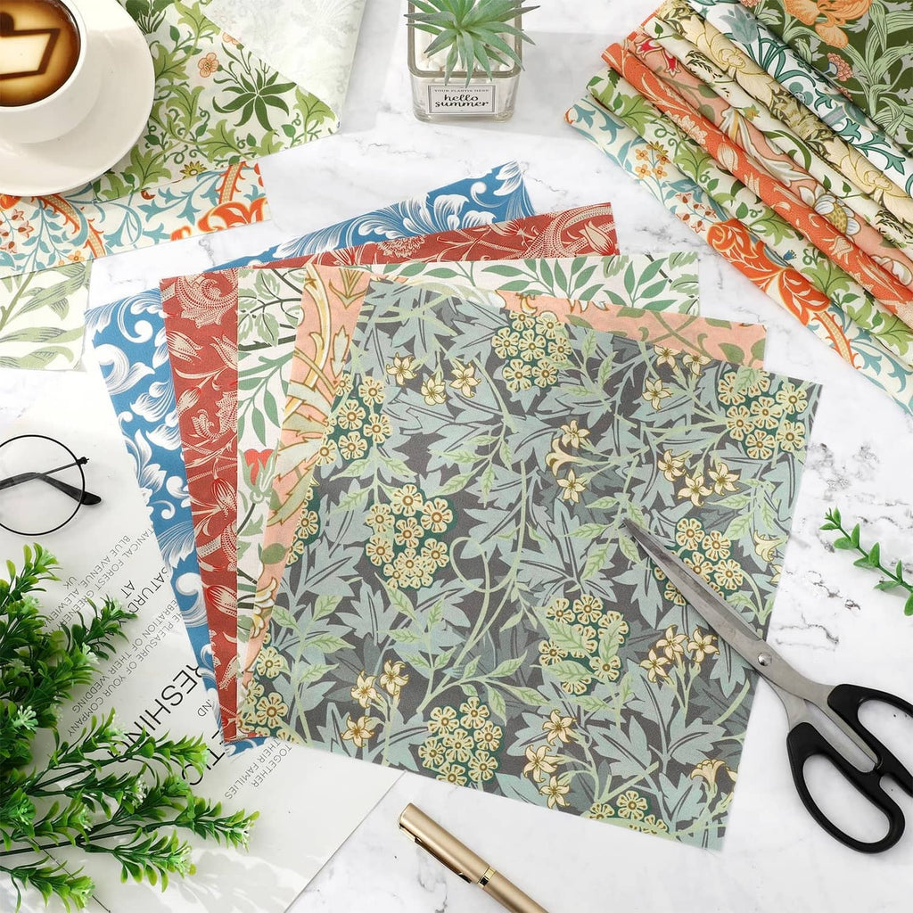 Assorted floral cotton fabric squares with blue, orange, and green prints