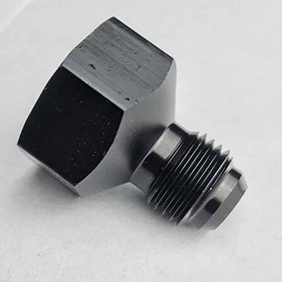 Aluminum AN reducer fitting, side view with male threads and hex body