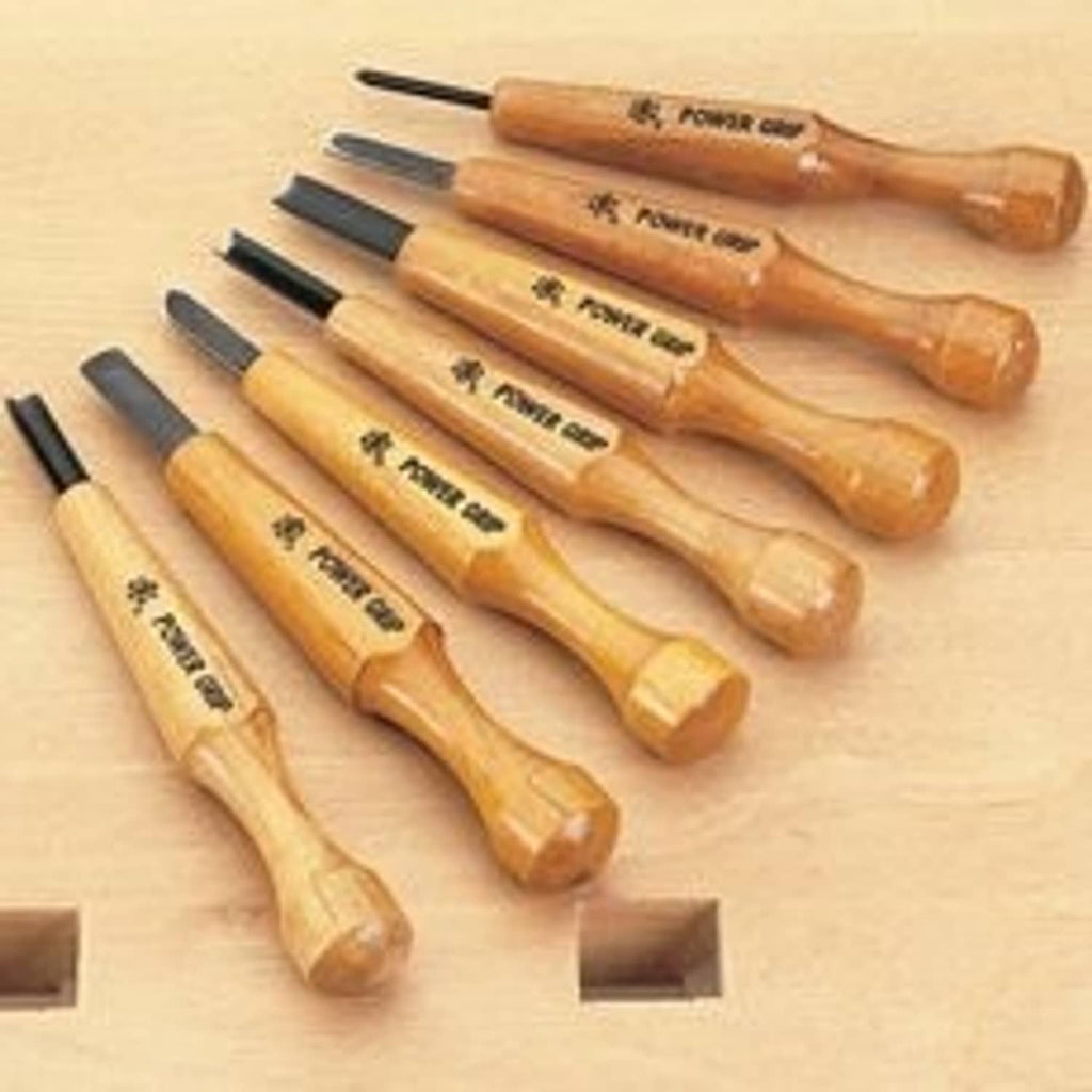7-piece carving tool set with wooden handles and metal chisel tips