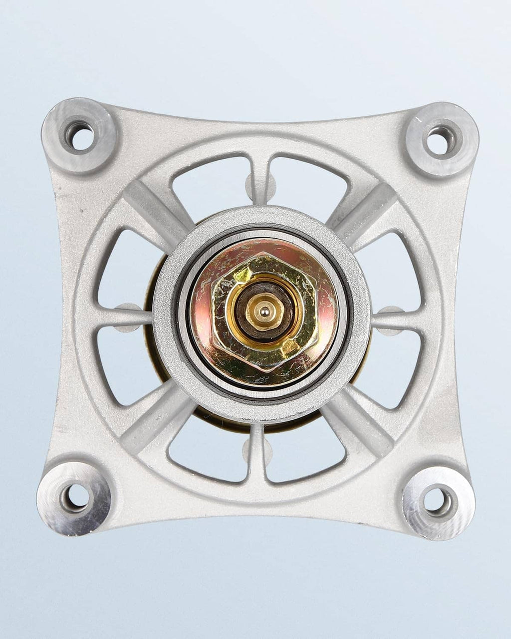 Spindle end cap with star drive opening and brass-colored center component.