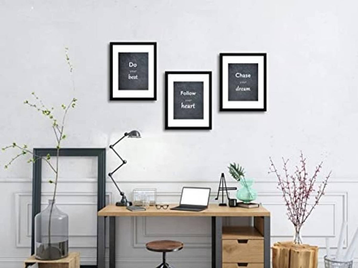 Black picture frame set of 3 displayed on wall with white mats and real glass