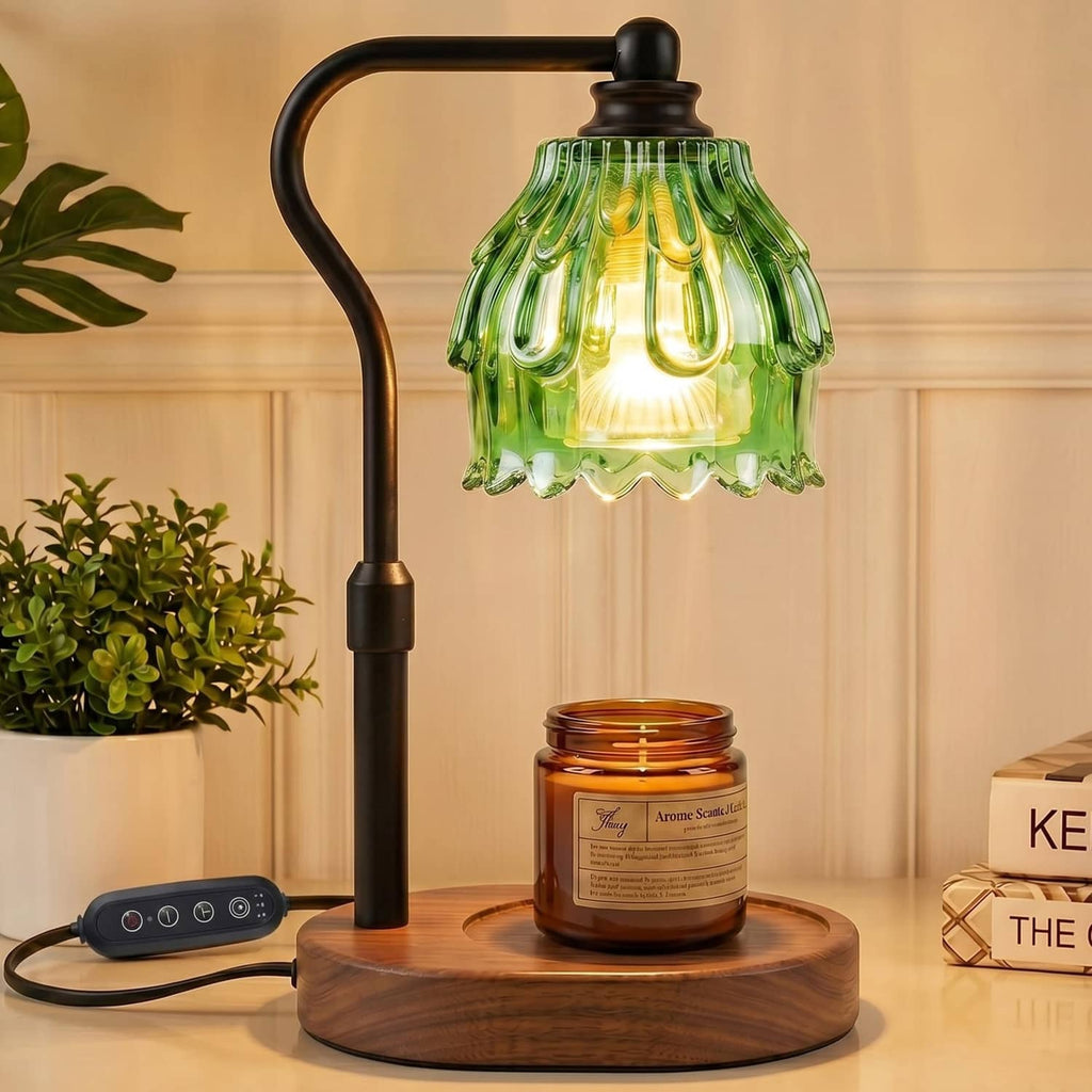 Flame-less candle warmer lamp with green glass shade on black stand, wooden base.