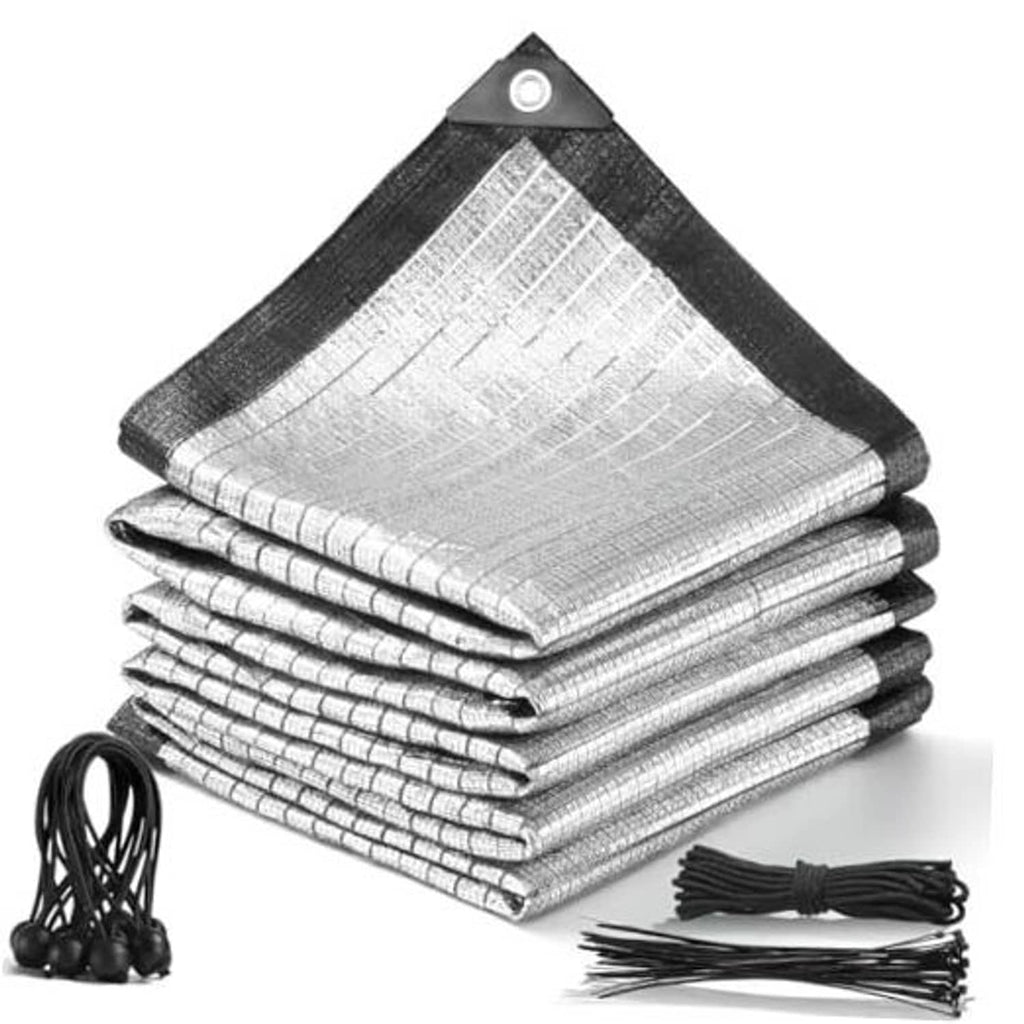 Silver aluminet shade cloth folded and stacked with black edging, grommets, and ties