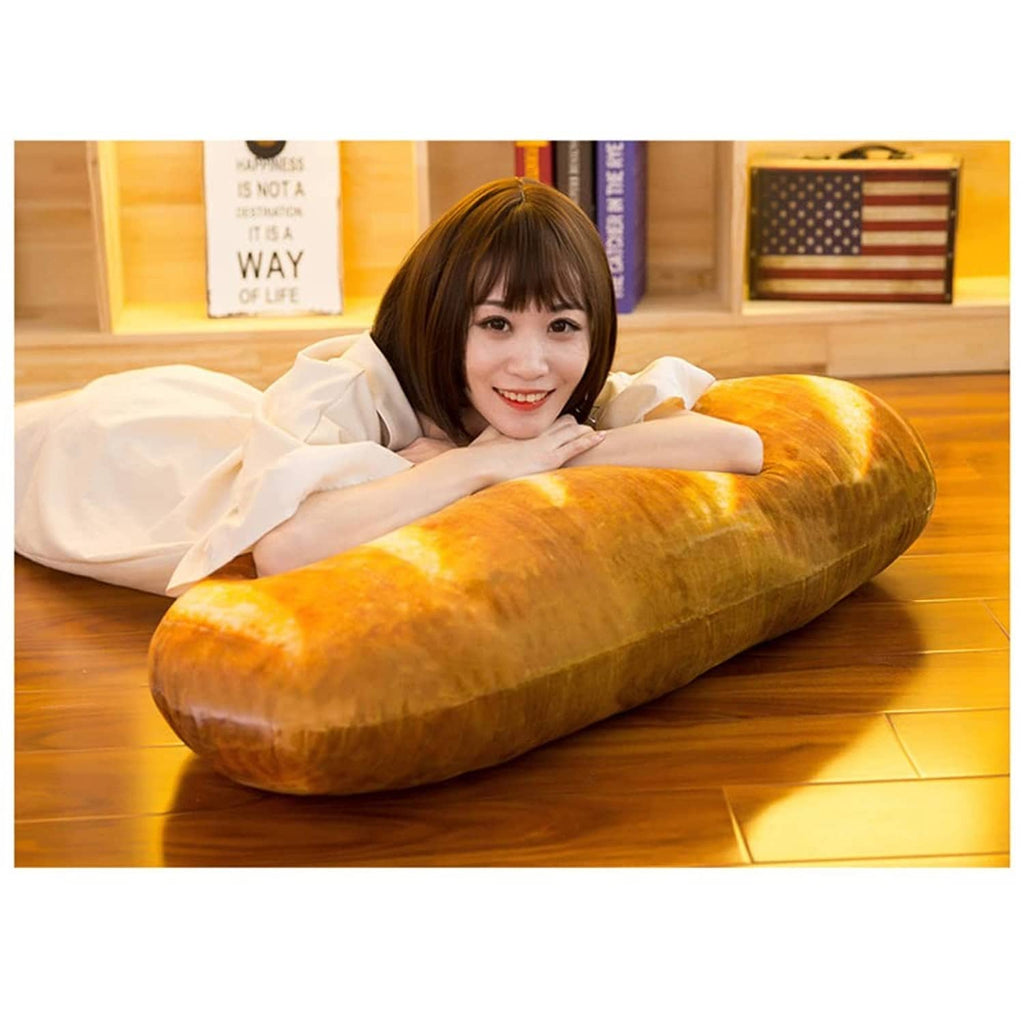 Loaf-shaped plush bread pillow in cinnamon-brown with bright cream slice stripes