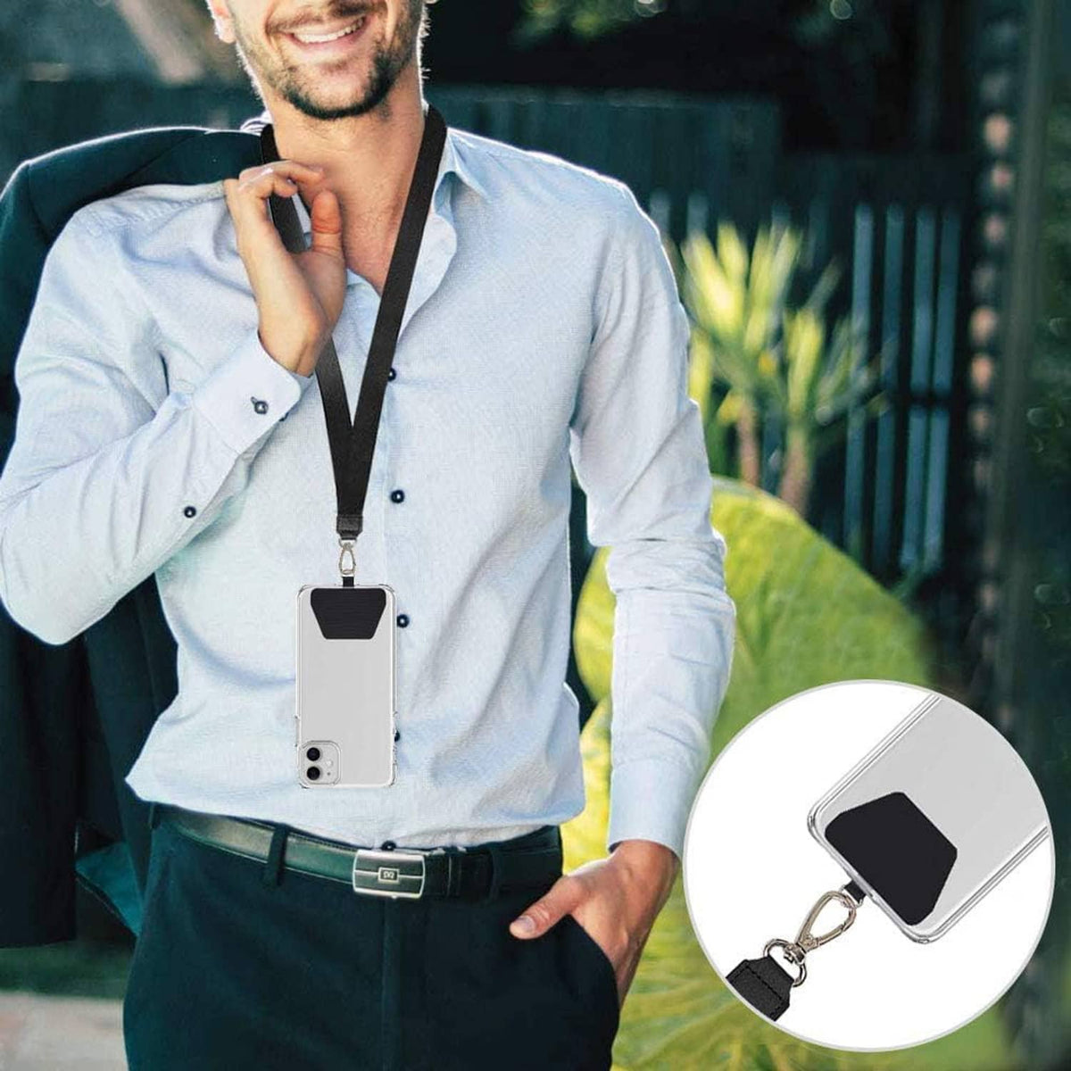 Phone tether tab with lanyard strap clipped to a phone by a charging-hole fit