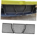 Front bumper mesh grille inserts set on a car, three-piece black diamond-pattern panels