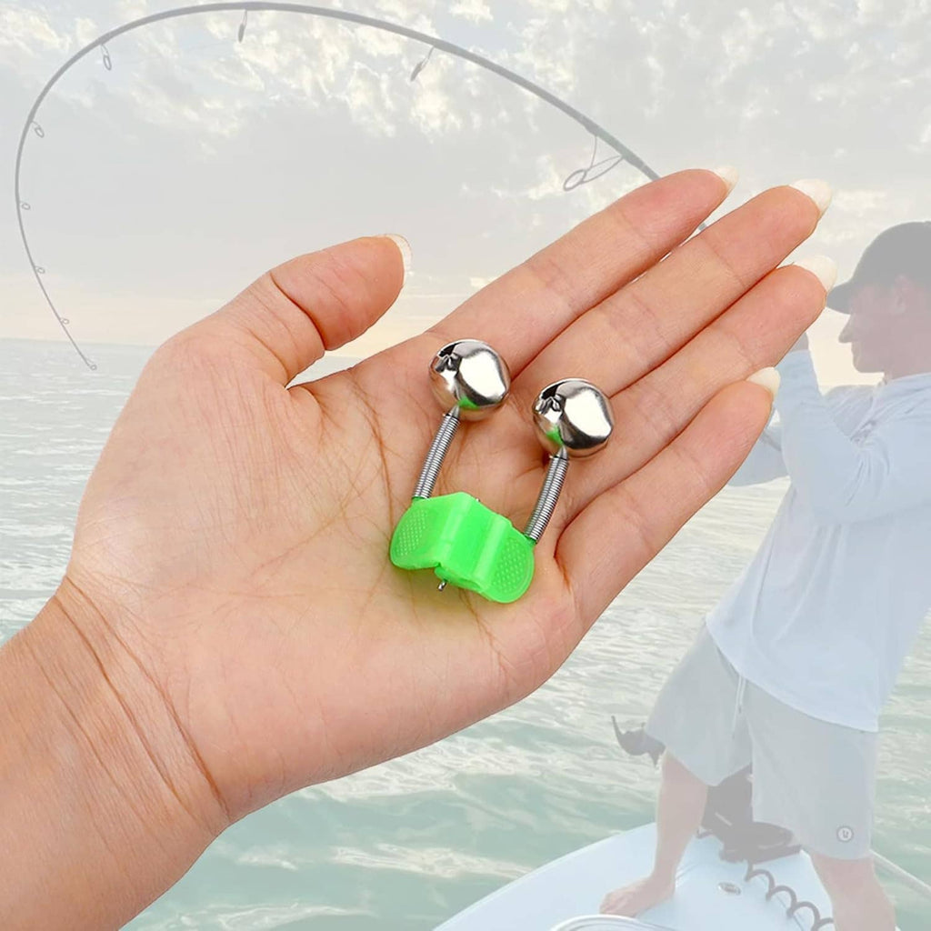 Two green and chrome fishing rod bite alarm bells held in a hand