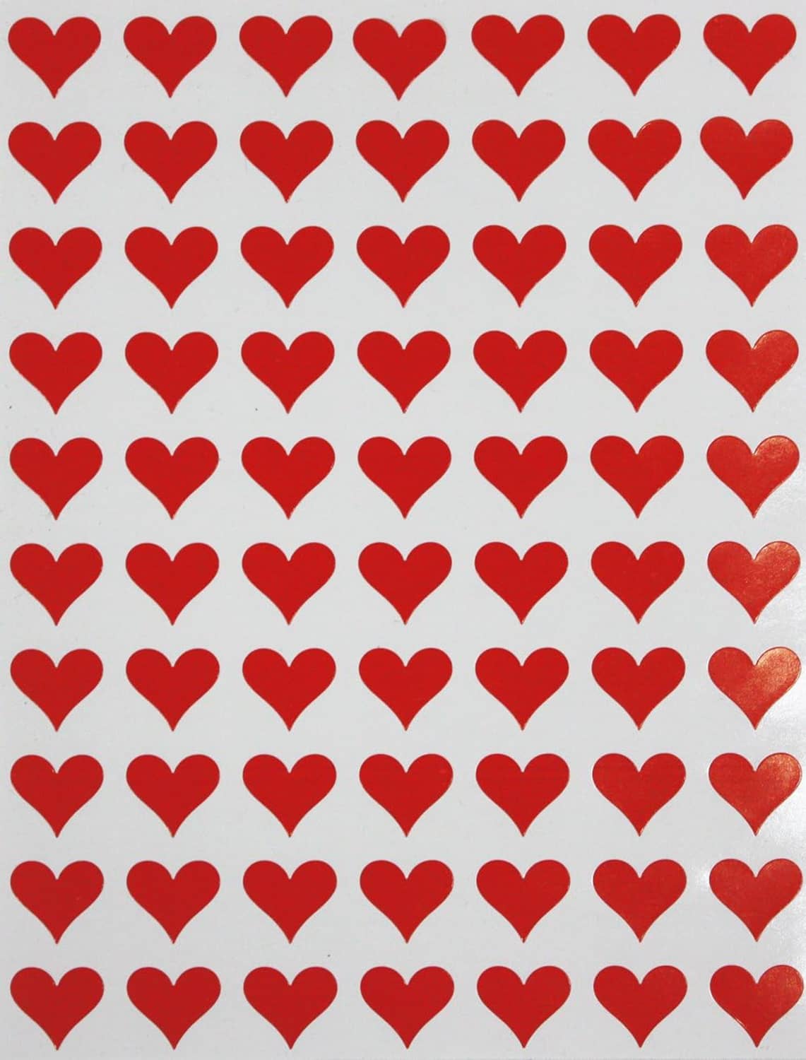 Repeating red heart stickers pattern on a white sticker sheet backing