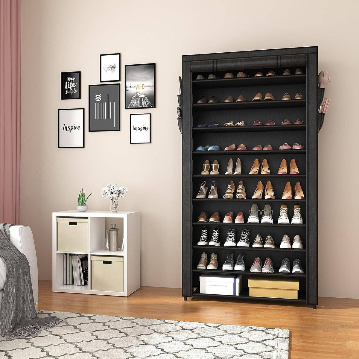 Tall black covered shoe cabinet with multiple shelves and side storage pockets