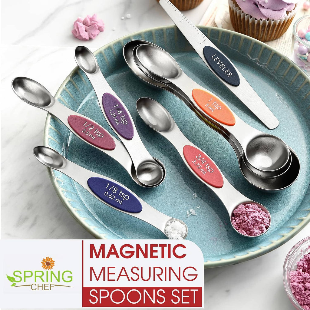 Stainless steel magnetic measuring spoons set with colored size labels on a tray