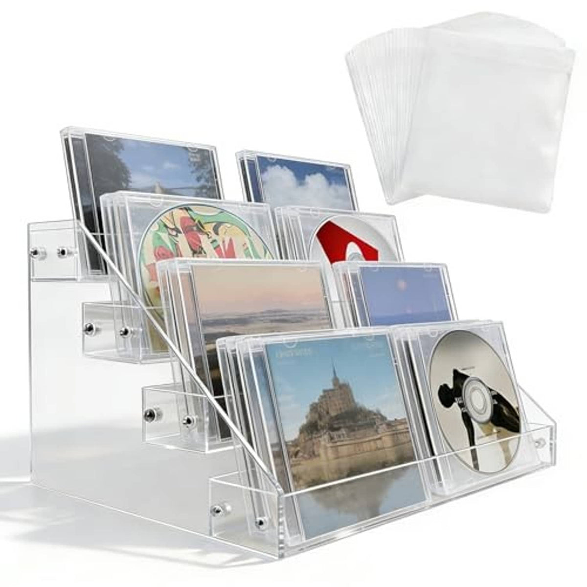Clear acrylic 4-tier CD/DVD display stand showing stacked CD cases on tiers