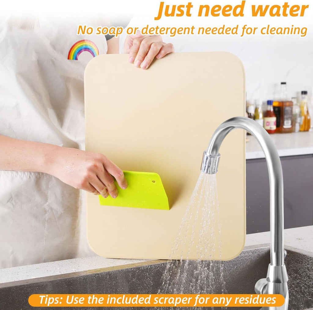 Beige pizza stone being cleaned with water and scraper accessory