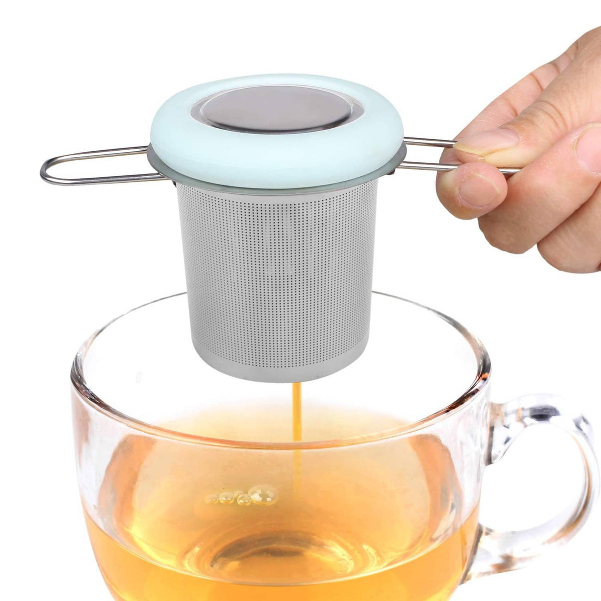 Light blue-lidded stainless tea infuser with folding handle above a cup of tea