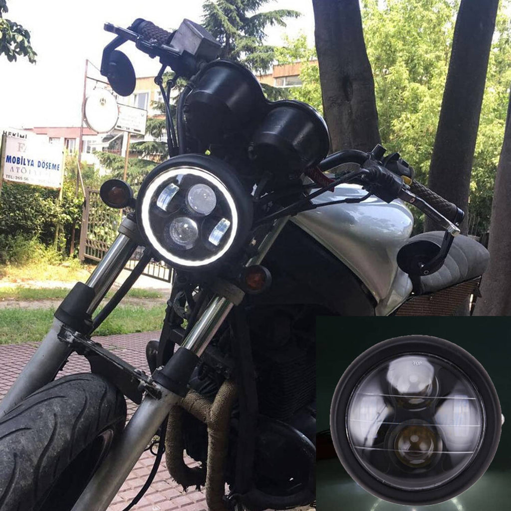 Round 6.5-inch motorcycle LED headlight mounted on a black cafe racer-style bike