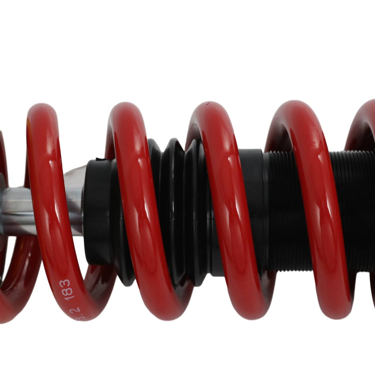 Close-up of red coil spring with black damping housing and mounting sleeve