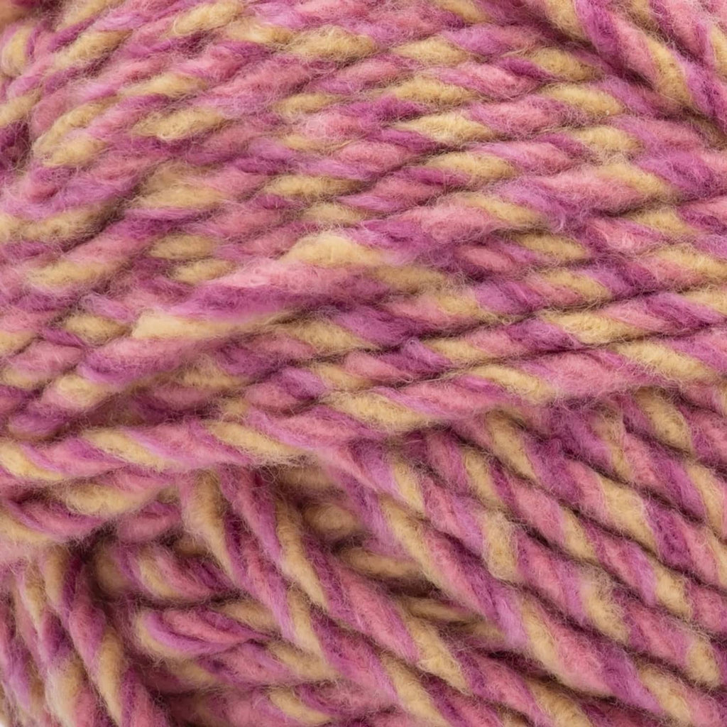 Super bulky fleece yarn close-up in pink, purple, and yellow heather texture