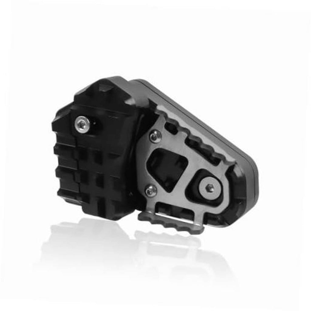 Black rear brake pedal extender pad with serrated grip and metal mounting screws